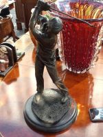 Statua golfista